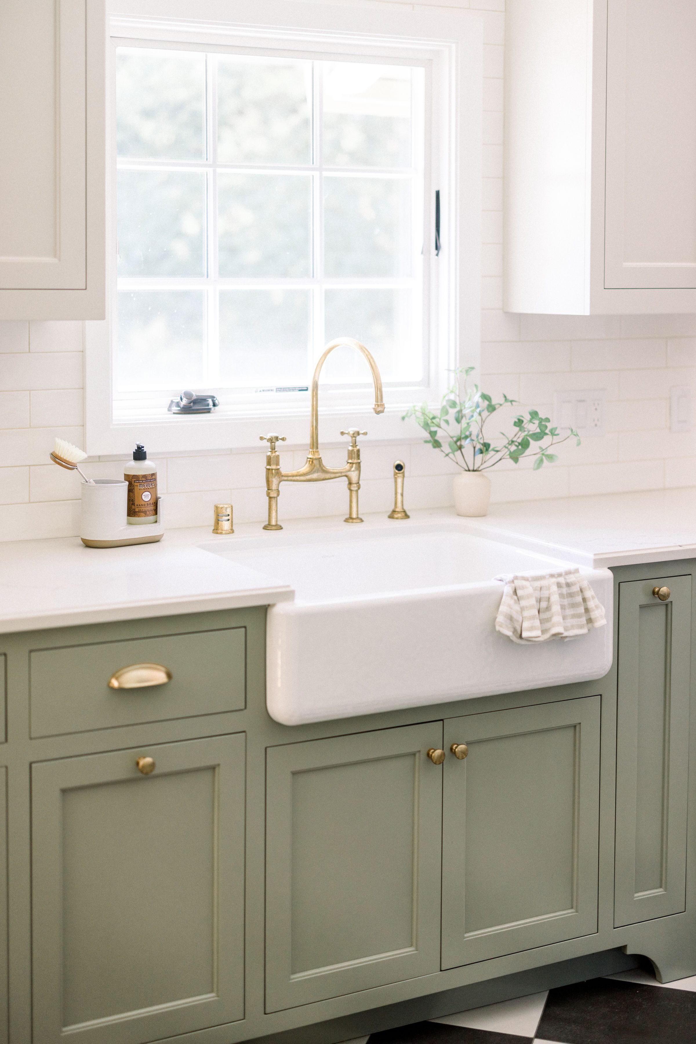 small kitchen remodel takes advantage of natural light from window by the sink